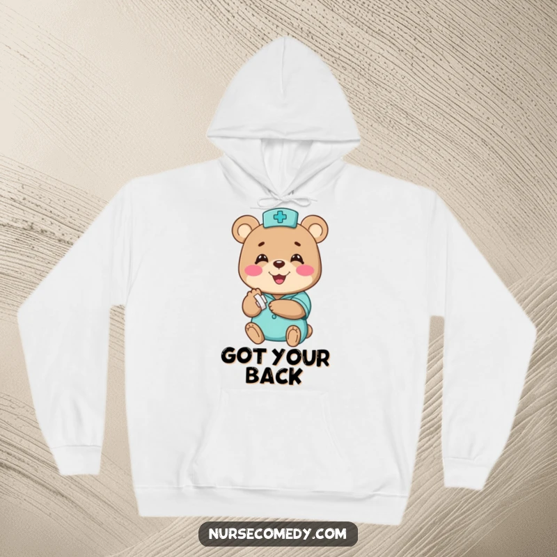 Funny bear nurse hoodie, a happy character humorously bandaging a small paw with a big smile, excellent funny gift.