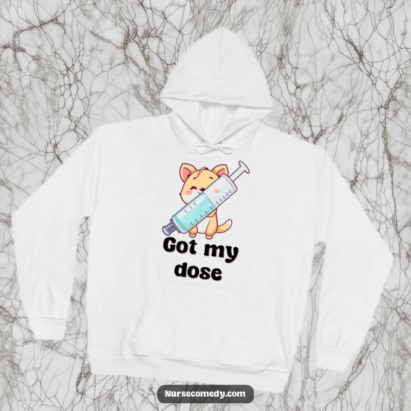 Funny animal character peeking from behind a giant syringe, cozy hoodie, perfect for cold days and laughs.