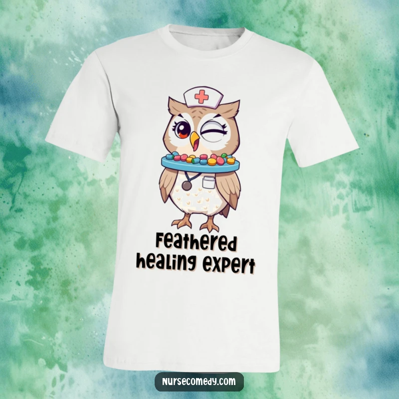 Funny Winking Owl Nurse T-Shirt: A comical owl dressed as a nurse balances a colorful pill tray on its beak, winking playfully.