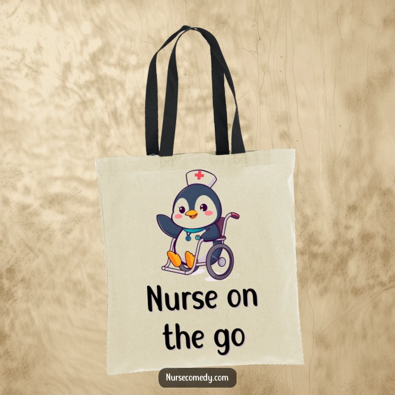 Funny Penguin Nurse Tote Bag with a cheerful penguin nurse sliding in a wheelchair and waving, great for shopping.
